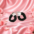 Black fur covered handcuff with key